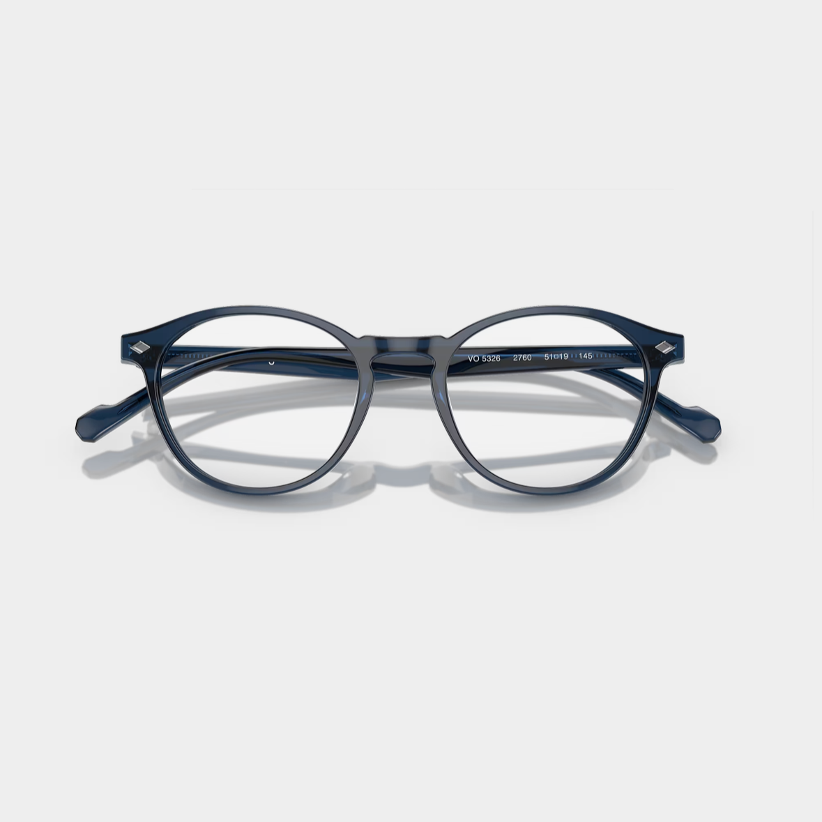 VOGUE 5326 - Xena Optic - Model Code: VO5326 2760 49-19 Frame shape: Round Front color: Transparent Blue Lens color: Demo Lens Frame material: Acetate - Eyeglasses VOGUE 