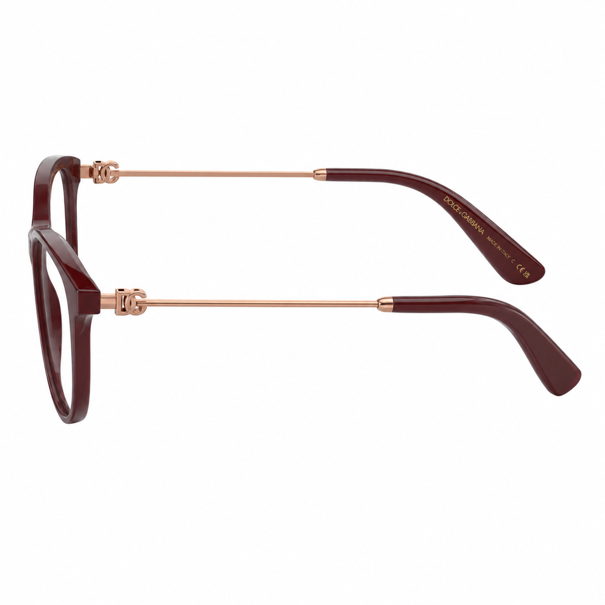 Dolce and  Gabanna optical eyeglasses featuring a dark burgundy acetate frame with rose gold metal temples, shown in a side profile view against a white background.